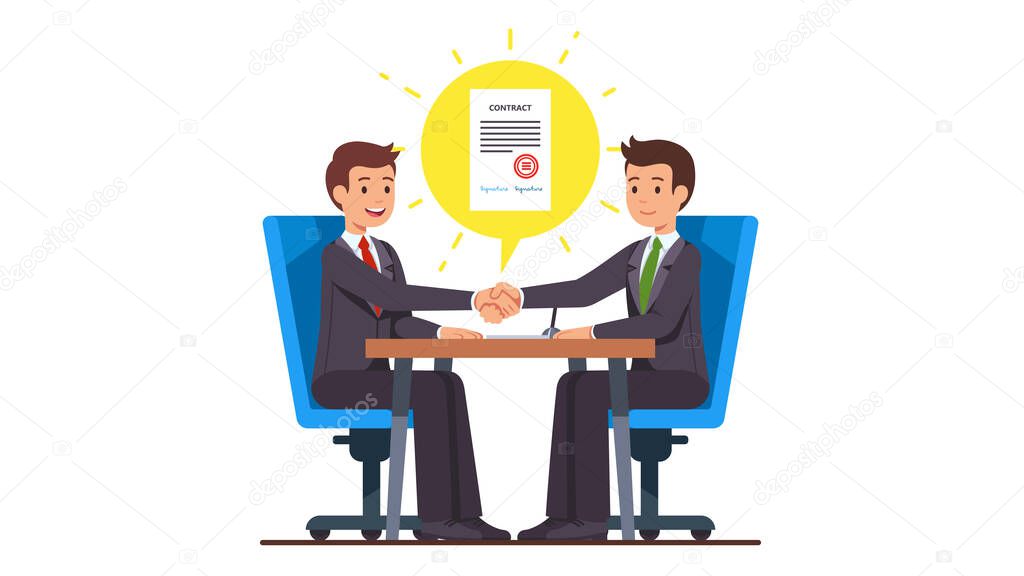 Business people shaking hands after closing deal