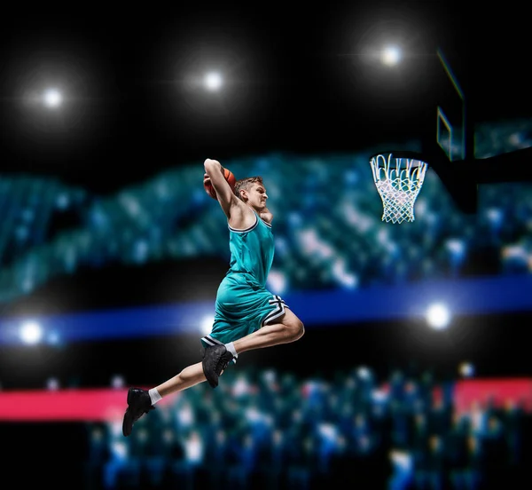 Basketball player making slam dunk on basketball arena — Stock Photo, Image