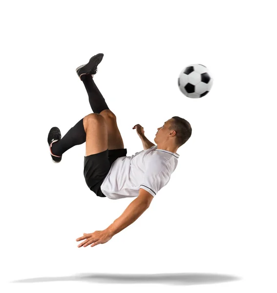 Futbolista pateando la pelota en el aire aislado en blanco — Foto de Stock