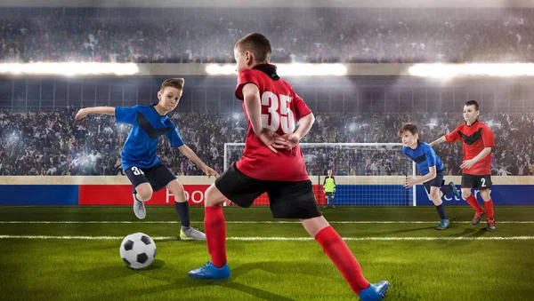 Kids fotball players struggling for the ball Stock Picture