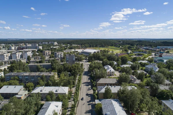 Top down aerial drone image of a Ekaterinburg city in the midst of summer, backyard turf grass and trees lush green. — Stock Photo, Image