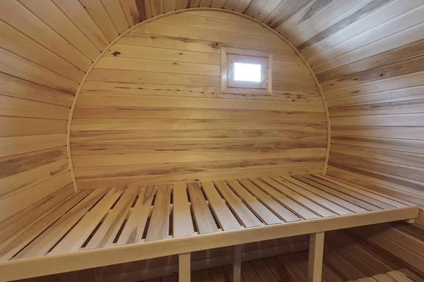 interior of  wooden bath in the form of a barrel. Rural mobile bath