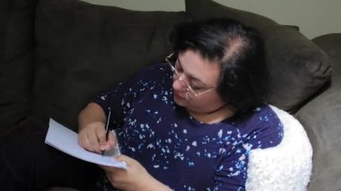 woman writing down notes