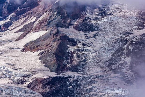 Stone slopes and glacial snow fields on mountain side — Stock Photo, Image