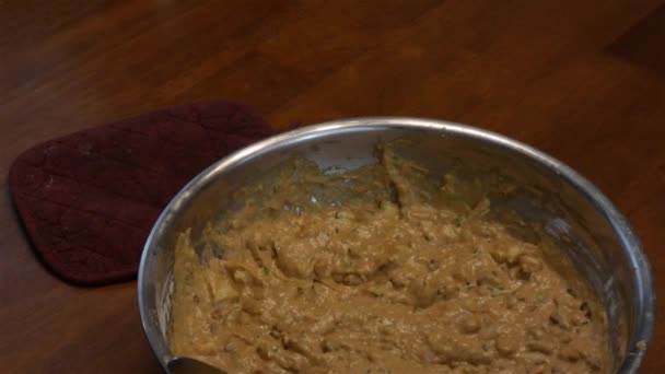 Batter in silver bowl and hot muffins in baking tin — Stock Video