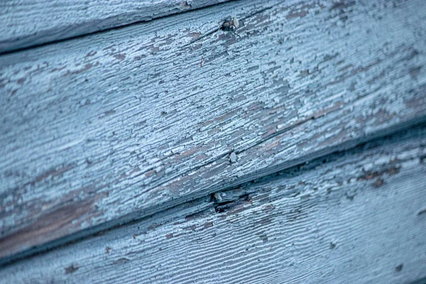 Blue boards with chipping paint pealing and needing to be repaired — Stock Photo, Image
