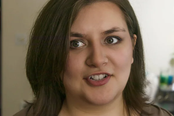 Girl looks on shocked by something questioning what she heard — Stock Photo, Image