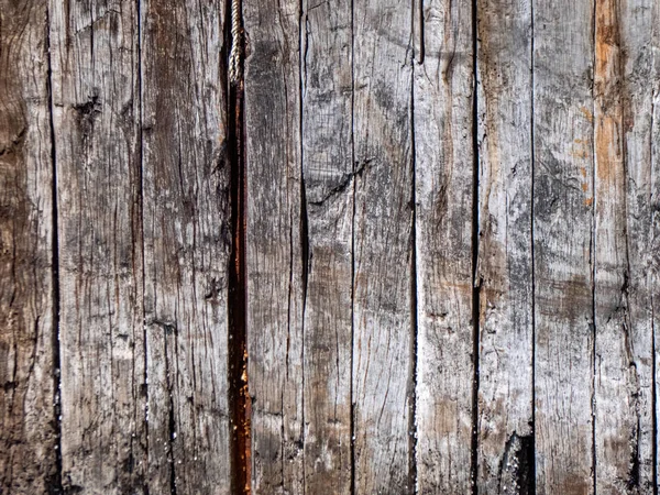 Vieja pared con textura de madera astillada dañada con la edad —  Fotos de Stock