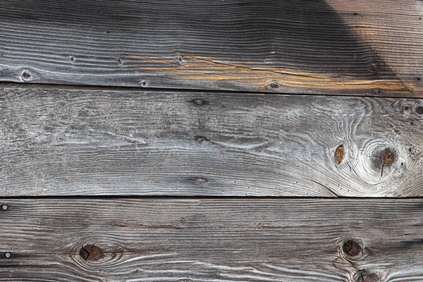 Vieja pared con textura de madera astillada dañada con la edad —  Fotos de Stock