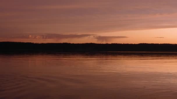 Puget sound with a yellow orange and pink sun set — стоковое видео