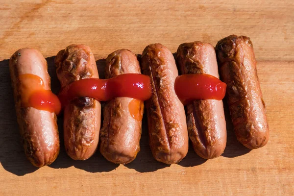 Grilled Sausages Ketchup Wooden Board — Stock Photo, Image