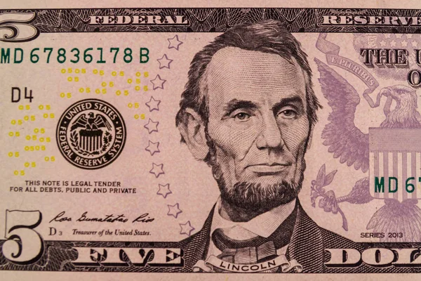 Fotografia macro da nota de cinco dólares — Fotografia de Stock