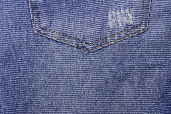 Jeans textuur achtergrond. Onderdeel van de blauwe jeans — Stockfoto