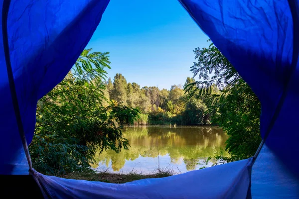 View on the lake from inside of a tent