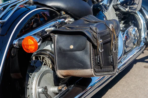 Leather biker bag on a motorcycle close-up. Concept travel on a motorcycle