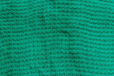Yeşil örgü doku. Örme kumaş arka plan