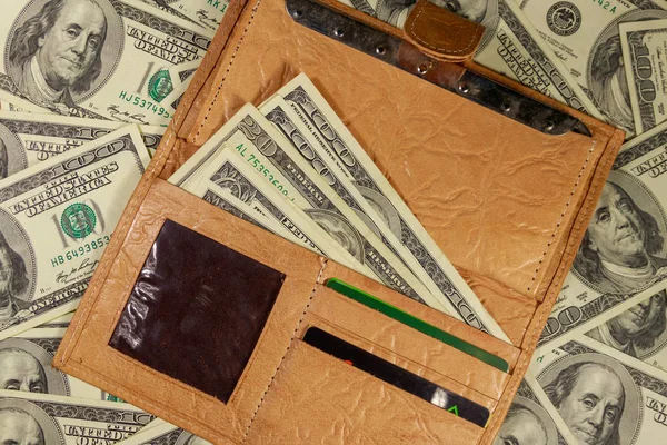 Opened wallet on the american one hundred dollar bills background — Stock Photo, Image