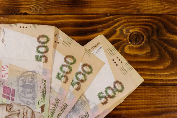 Ukrainian currency. Five hundred hryvnia banknotes on wooden desk — Stock Photo, Image