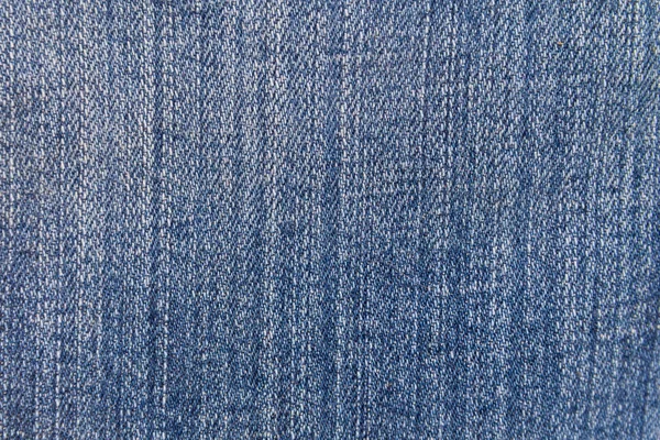 Jeans textuur achtergrond. Onderdeel van de blauwe jeans — Stockfoto