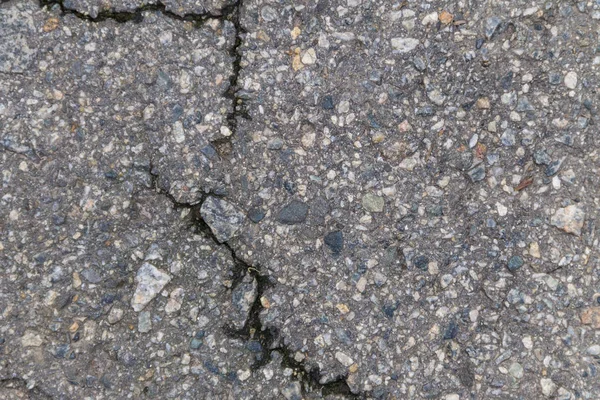 Texture con crepe su fondo asfalto — Foto Stock