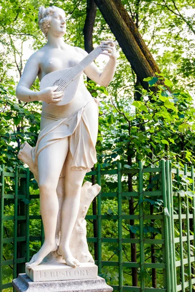 Sculpture of Greek goddess of dance and chorus Terpsichore in old city park \