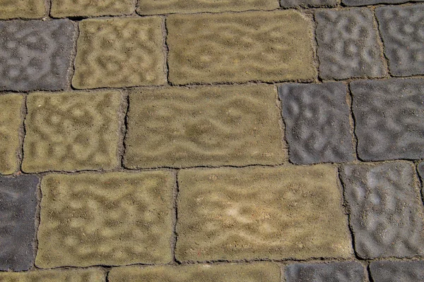 Sidewalk texturierten Hintergrund. Detail eines Pflasters — Stockfoto