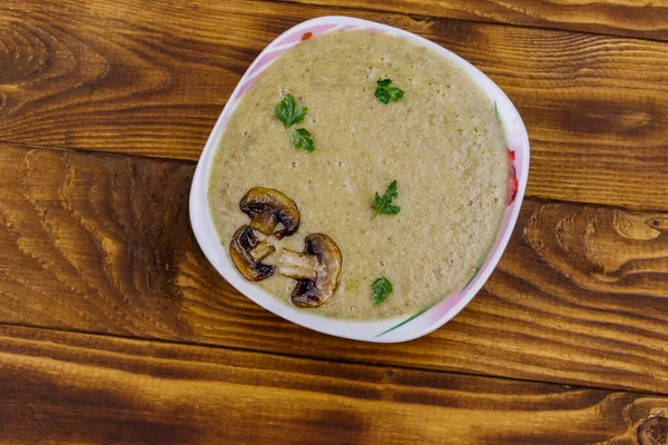 Mushroom cream soup on a wooden table. Top view — Stock Image Mushroom Cream Soup Wooden Table Top View Stock Picture