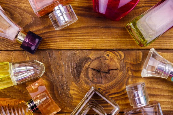 Different Bottles Perfume Wooden Background Top View Copy Space — Stock Photo, Image