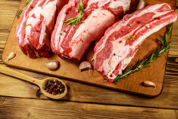 Raw Pork Ribs Spices Garlic Rosemary Wooden Table — Stock Photo, Image