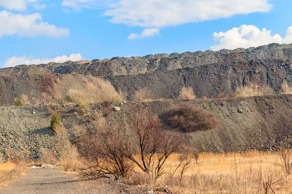 View of slag heaps of iron ore quarry. Mining industry