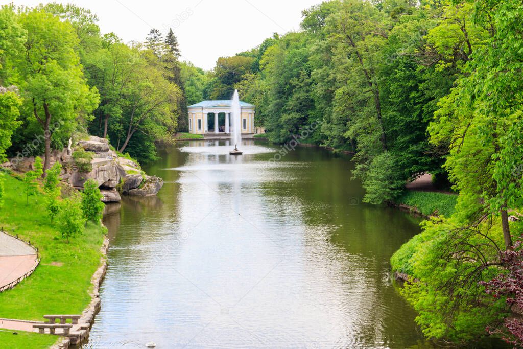View of a lake with Snake Fountain and Flora Pavilion in Sofiyivka park in Uman, Ukraine