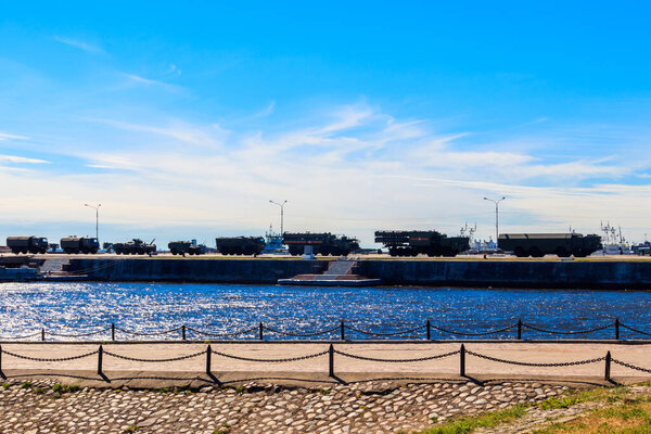 Military vehicles at a pier in Kronstadt, Russia