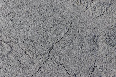 Arka plan olarak ıslak çatlamış zemin dokusu