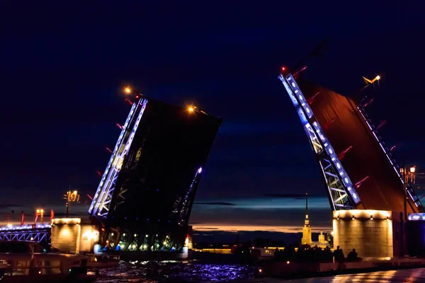 Opening of Palace drawbridge. Night view of Palace bridge from the Neva river in Saint Petersburg, Russia