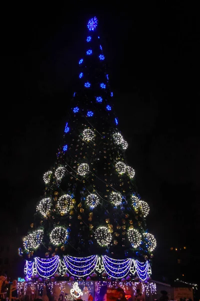 Ornate and illuminated Christmas tree in the city centre