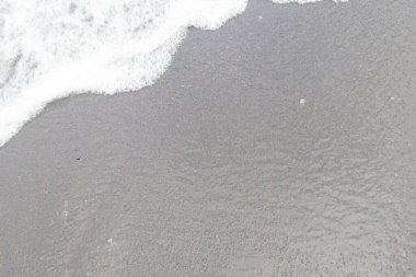 Ocean wave at black sand beach on Tenerife, Canary islands, Spain
