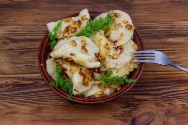 Delicious homemade dumplings on a wooden table
