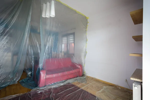 Flat renovation, living room secured with protective film