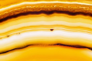 Soyut arka plan, sarı kahverengi dilim çizgili mineral kesit