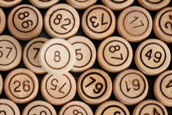 Lucky number 8 on the background of wooden keg lotto. Close up
