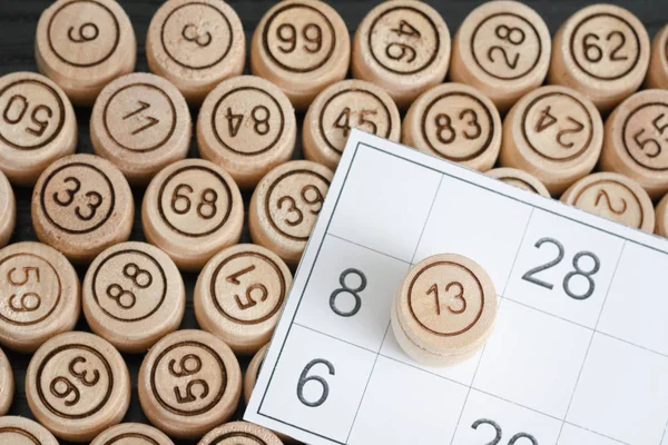 Lotto card close-up and wooden kegs