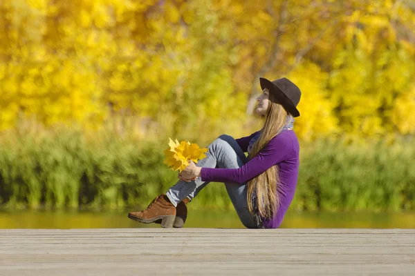 Thoughtful Girl Sitting Dock Autumn Leaves Hands Sunny Day — Stock Photo, Image