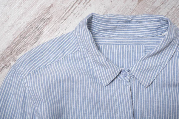 Fashionable concept. Collar  blue striped shirt. Top view