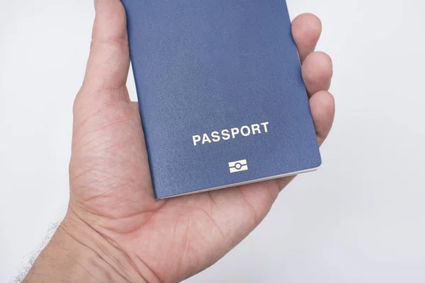 Passaporte Azul Com Biometria Mão Homem Fundo Branco — Fotografia de Stock