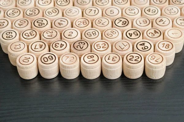 Wooden kegs on a black background. Top view