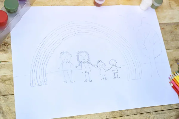 Children's sketch in pencil. Family and rainbow