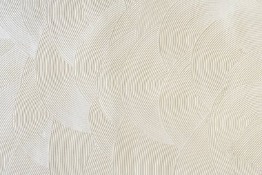 Beyaz sıva üzerinde dairesel desenler. Soyut doku.