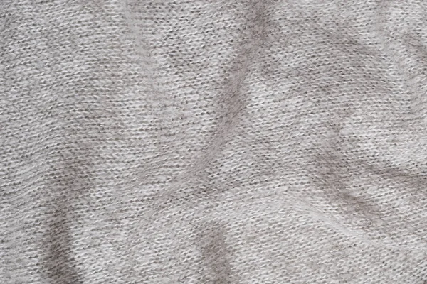 Tekstura dzianiny sweter z wełny szarej. Zbliżenie. Fałdy — Zdjęcie stockowe