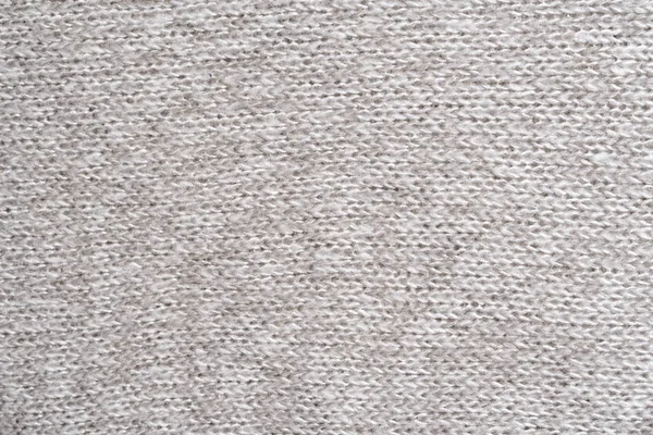 Textur eines Strickpullis aus grauer Wolle. Nahaufnahme. nahtlos — Stockfoto