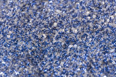 Beyaz ve mavi payetler ile kumaş dokusu. Close.